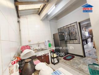 Image of a kitchen with a view into the living space