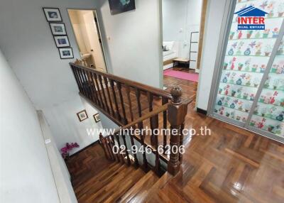 Interior view of a house with wooden stair railing