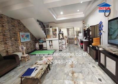 Living room with modern furniture and decorative stone wall