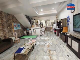 Living room with modern furniture and decorative stone wall