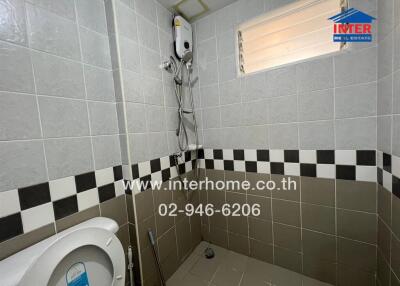 Clean tiled bathroom with shower