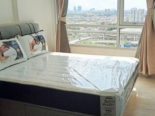 Bedroom with a large window view