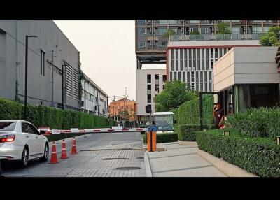 Gated community entrance with security personnel