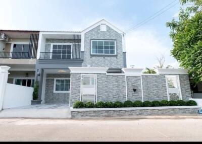 Modern two-story house with a stone facade