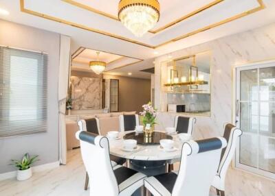 Elegant dining area with modern decor and luxury lighting