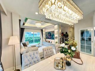 Elegant living room with modern decor and chandelier