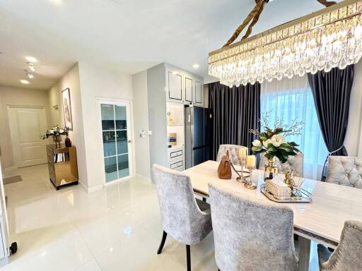 modern dining room with chandelier and elegant furnishings