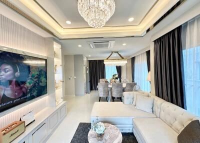 Modernly decorated living room with a dining area and elegant furnishings