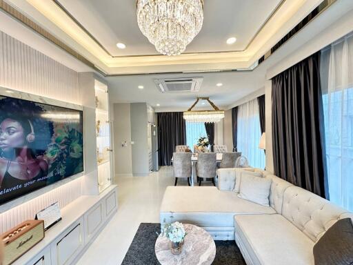 Modernly decorated living room with a dining area and elegant furnishings