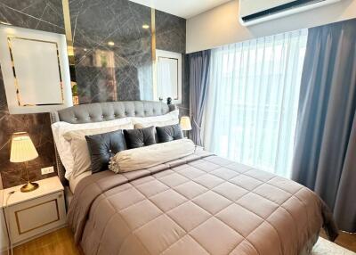 Modern bedroom with a large bed and stylish decor