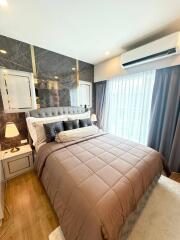 Modern bedroom with a large bed and stylish decor