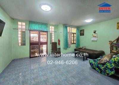 Living room with furniture and windows