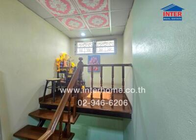 Staircase and landing area with decorative ceiling