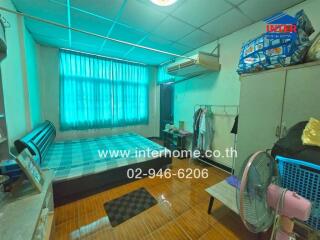 Bedroom with furniture and window with curtains