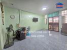 Living room with tiled floor and mint green walls