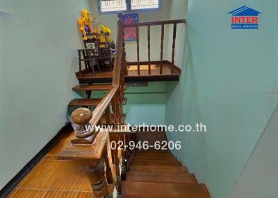 Wooden staircase with decorative items and window