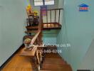 Wooden staircase with decorative items and window