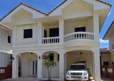 Front view of a residential house with a driveway