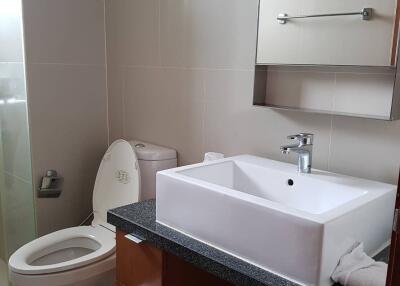 Modern bathroom with a square white sink and toilet