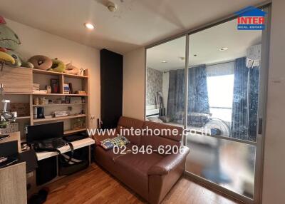 Cozy living room with brown leather sofa and workstation