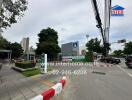 Street view with commercial buildings and greenery