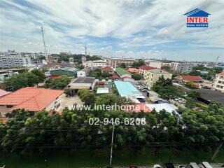 Aerial view of a residential neighborhood with greenery and buildings