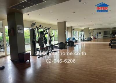 Spacious gym with various workout equipment