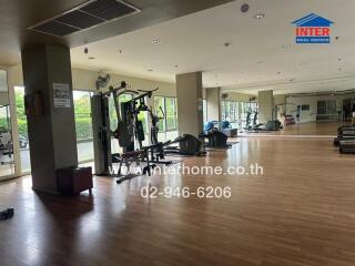 Spacious gym with various workout equipment