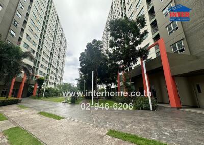 Exterior view of residential buildings with trees and walkway