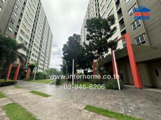 Exterior view of residential buildings with trees and walkway