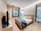 modern bedroom with large windows and double bed