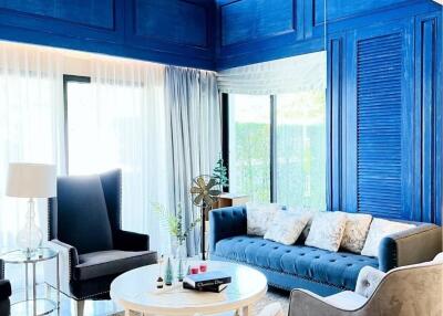 Spacious and modern living room with blue accents