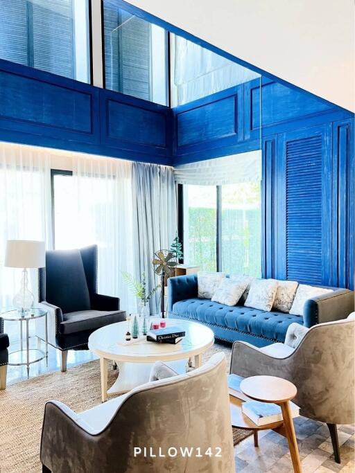 Spacious and modern living room with blue accents