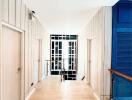 Modern hallway with light wood paneling and contemporary decor