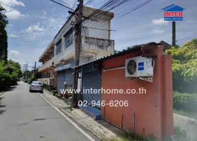 Street view of a building with an air conditioning unit