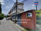 Street view of a building with an air conditioning unit