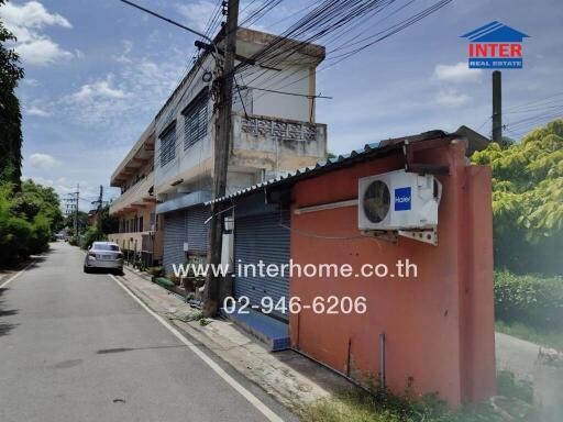 Street view of a building with an air conditioning unit