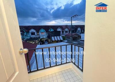 Balcony with view of neighboring houses