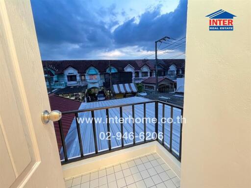 Balcony with view of neighboring houses