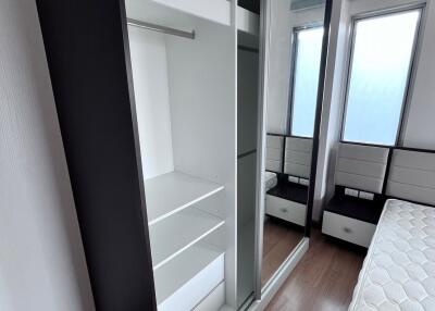 Modern bedroom with fitted wardrobe and natural light