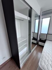 Modern bedroom with fitted wardrobe and natural light