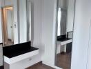 Modern bedroom with vanity and mirror closet