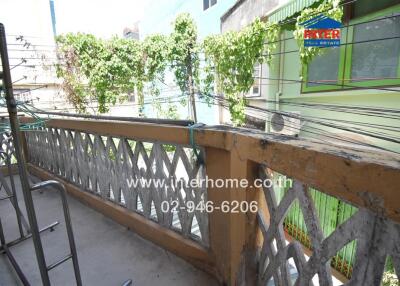 Balcony with plants and building view