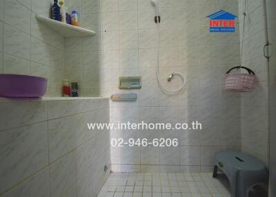 Bathroom with shower and tiled walls