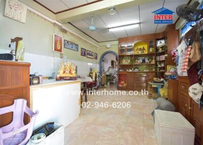 Kitchen area with various appliances and storage