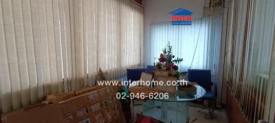 Living room with glass table and blue chairs