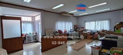 Main living area with boxes and furniture