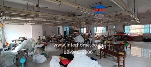 Industrial workspace with sewing machines and fabric