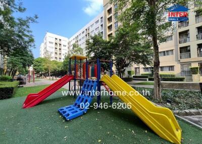 Playground area in apartment complex with slides and climbing equipment