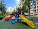 Playground area in apartment complex with slides and climbing equipment